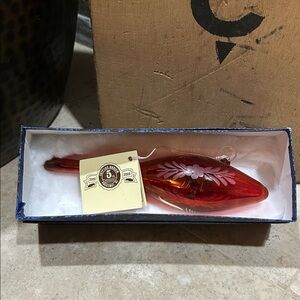 EGYPTIAN MUSEUM glass ornament featuring a red and amber (Amberina)